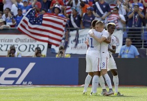 USAs Aron Johannsson (center) celebrates with Timmy Chandler (left) and Gyasi Zardes